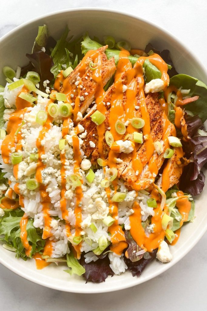 overhead shot of a prepared buffalo chicken rice bowl - one of many low calorie dinner ideas