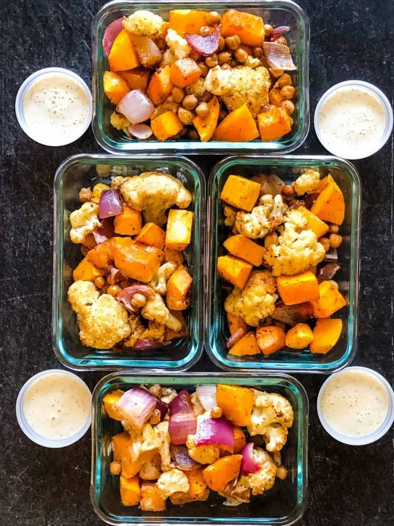 vegan sheet pan meal portioned into glass meal prep containers