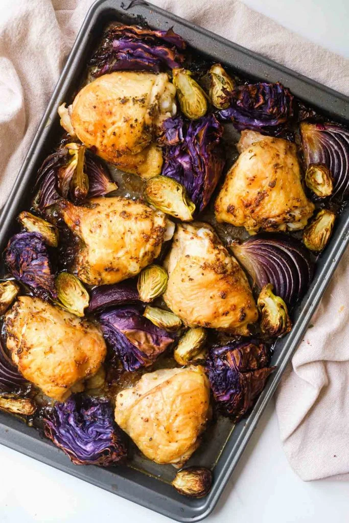 overhead shot of Sheet Pan Chicken Thighs with Brussels Sprouts and Cabbage