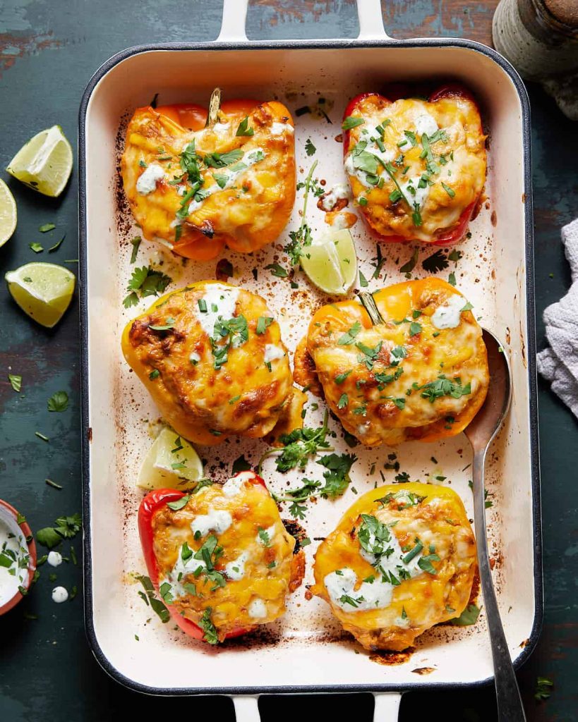 overhead shot of Cheesy Chicken Stuffed Peppers in a casserole dish