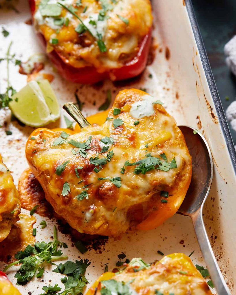 overhead shot of Cheesy Chicken Stuffed Peppers in a casserole dish