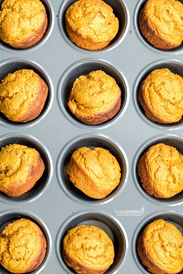 overhead shot of baked Low Calorie Pumpkin Muffins with Cake Mix in a muffin pan