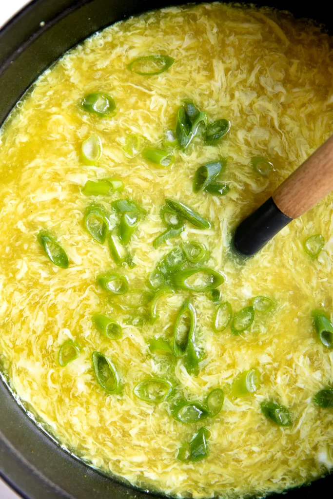 Egg Drop Soup in a pot with a ladle in it