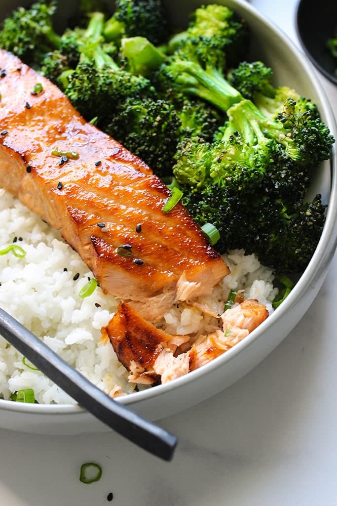 Air Fryer Honey Garlic Salmon in a white bowl with white rice and broccoli - one of the recipes from this week's healthy weekly meal plan