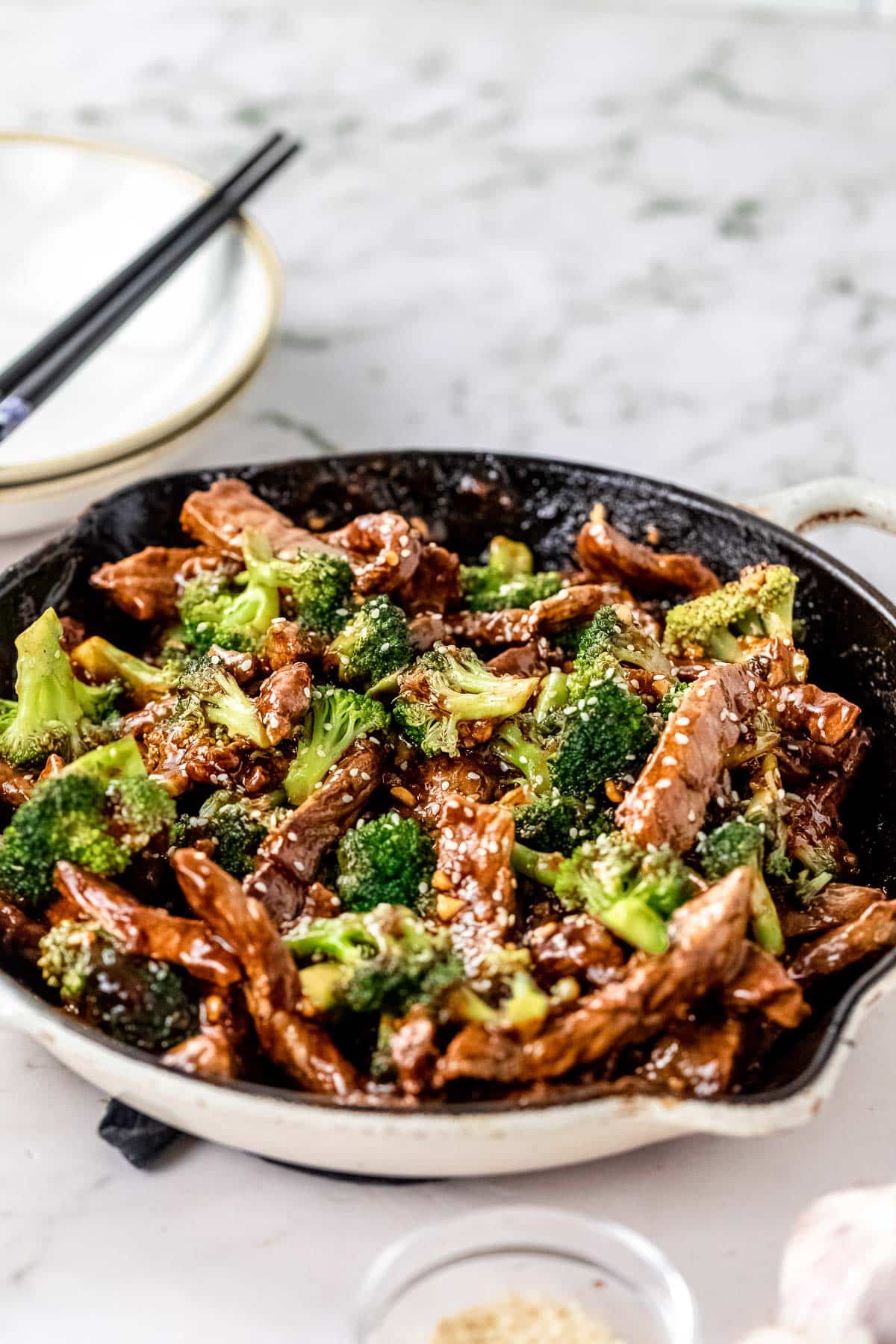 a cooked beef and broccoli recipe in a cast iron skillet ready to serve