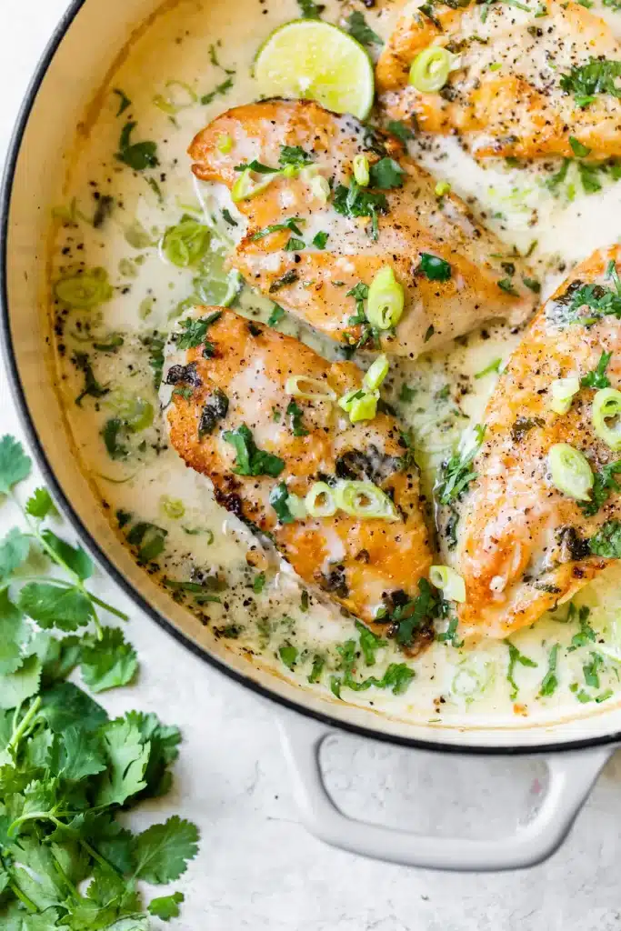 Creamy Coconut Lime Chicken in a white cast iron skillet - one of the recipes from this week's healthy weekly meal plan
