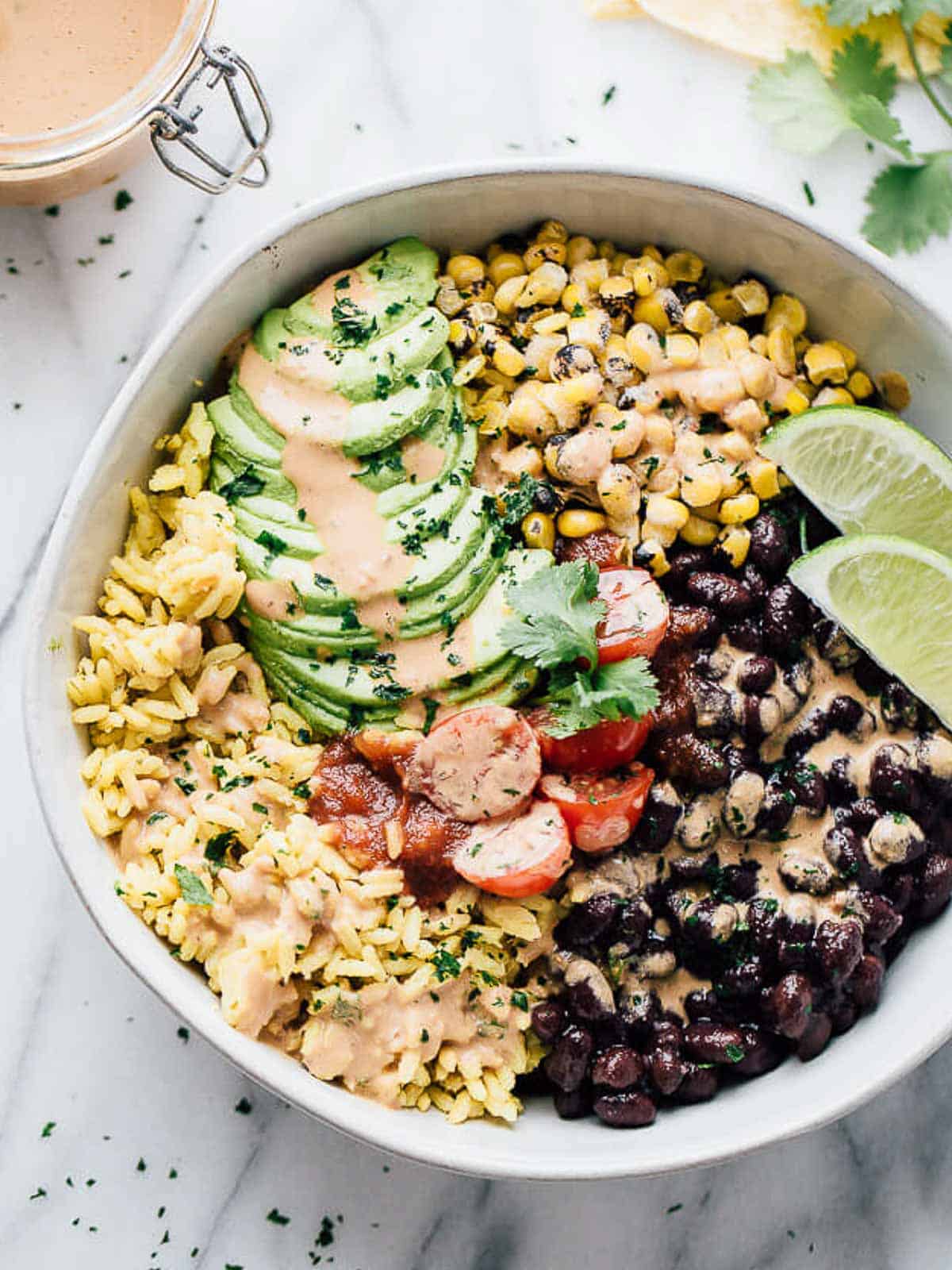 overhead shot of a black bean burrito bowl ready to serve for this week's healthy weekly meal plan