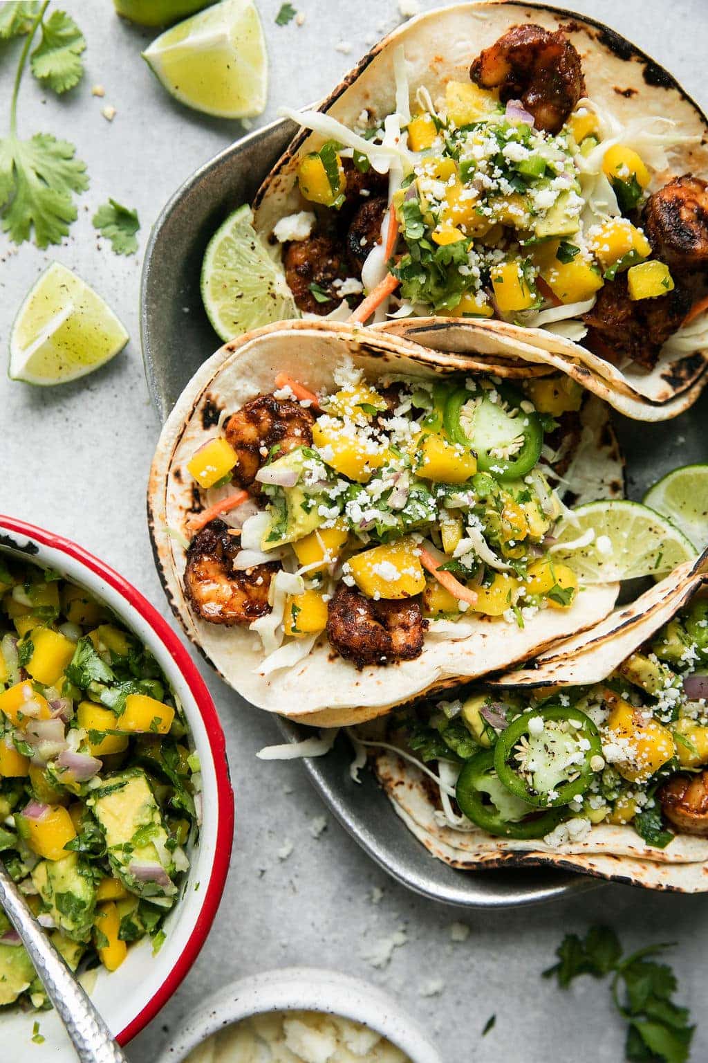 Grilled Shrimp Tacos with Mango and Avocado Salsa on a plate ready to be served - one of the recipes for this week's healthy weekly meal plan