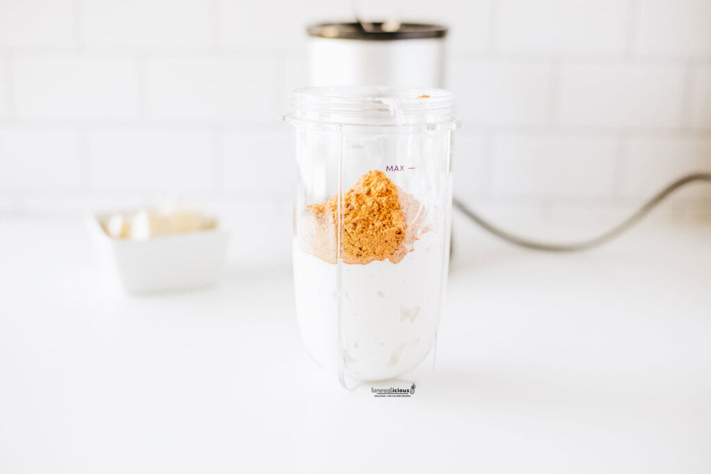 cottage cheese and taco seasoning in a blender canister to make Viral TikTok Cottage Cheese Queso