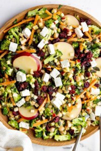 Healthy Broccoli Apple Salad Recipe with Cranberries in a large wood bowl