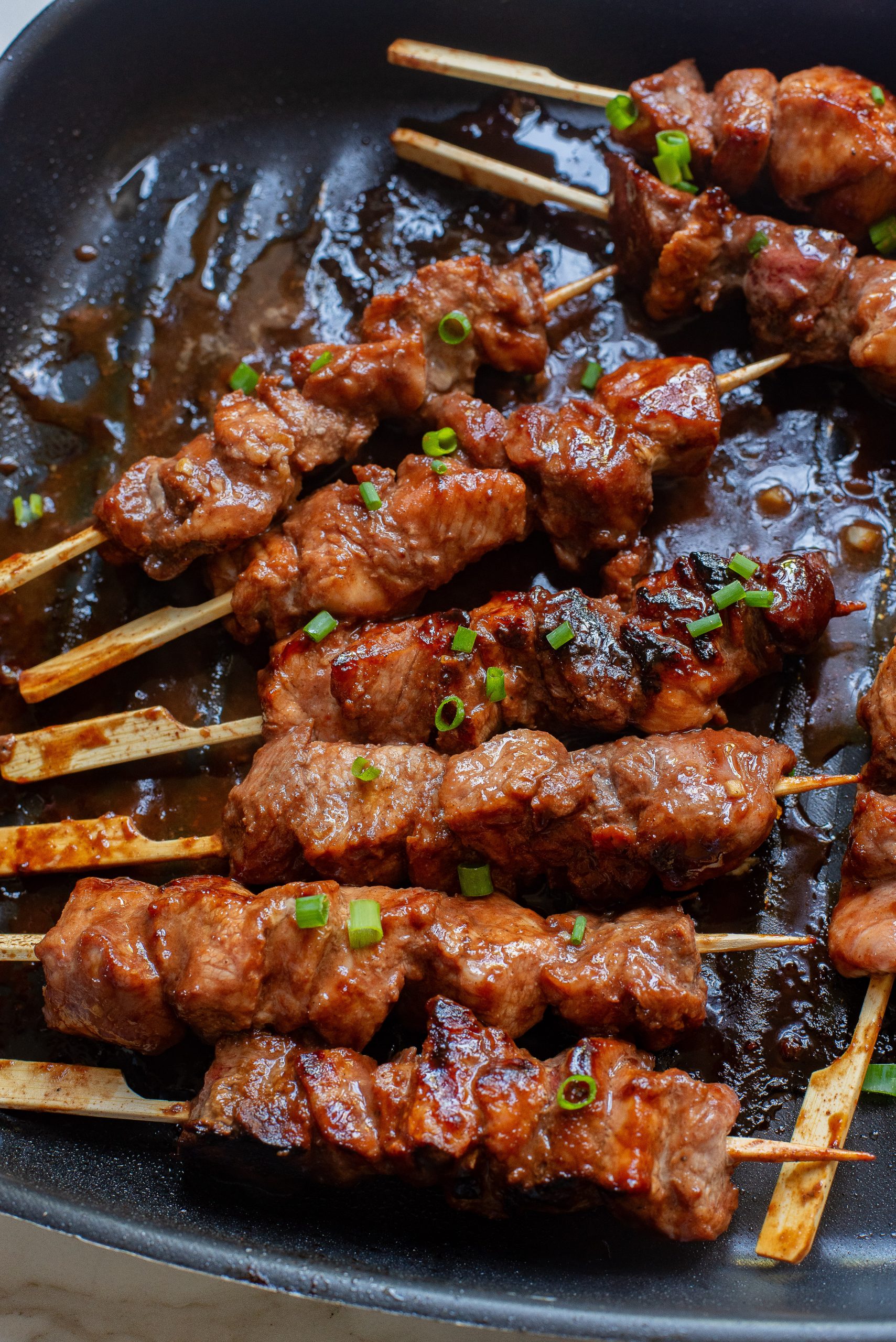 Hoisin Pork Tenderloin cut into strips and grilled in a grill pan on bamboo skewers - one of the recipes for this week's healthy weekly meal plan
