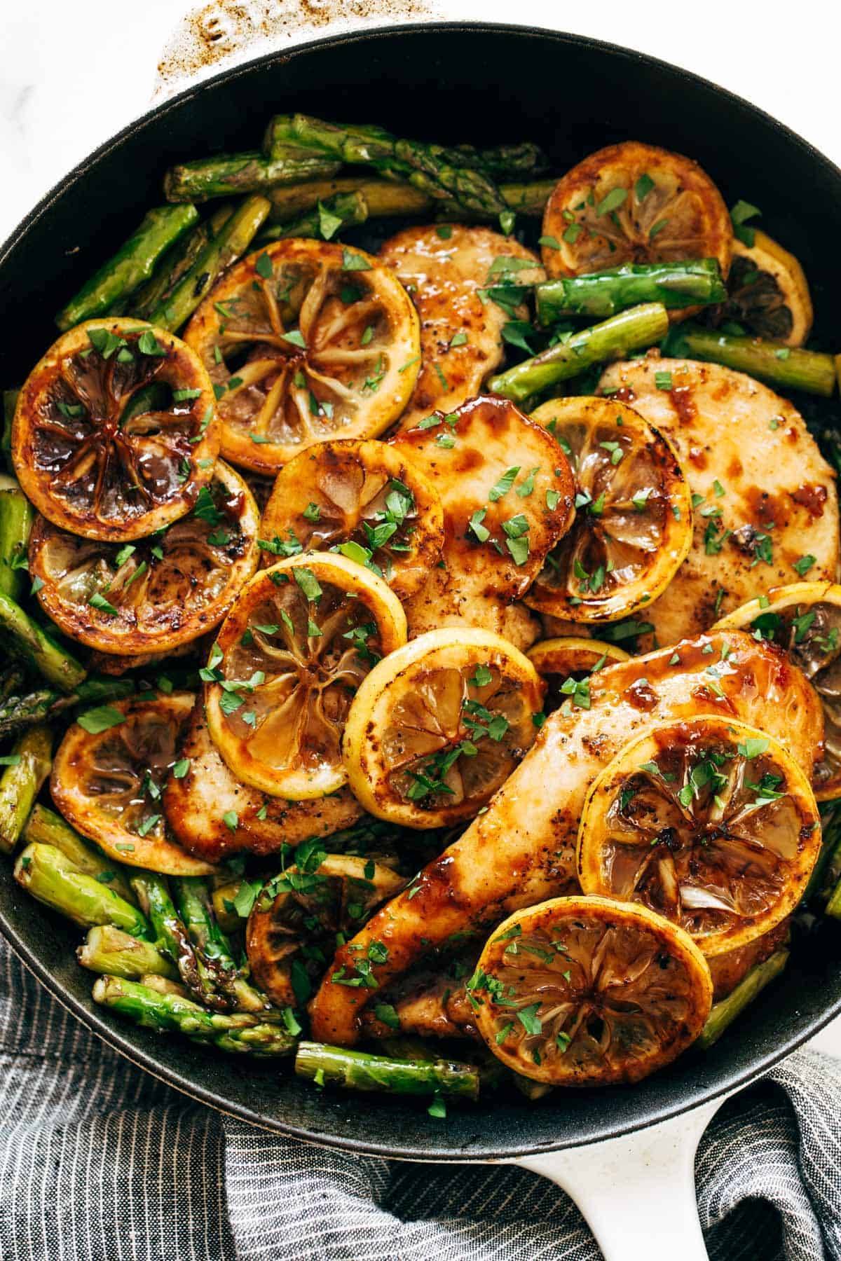 Lemon Chicken with Asparagus cooked in a cast iron skillet ready to serve