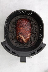 cooked Air Fryer Meatloaf in a black air fryer basket