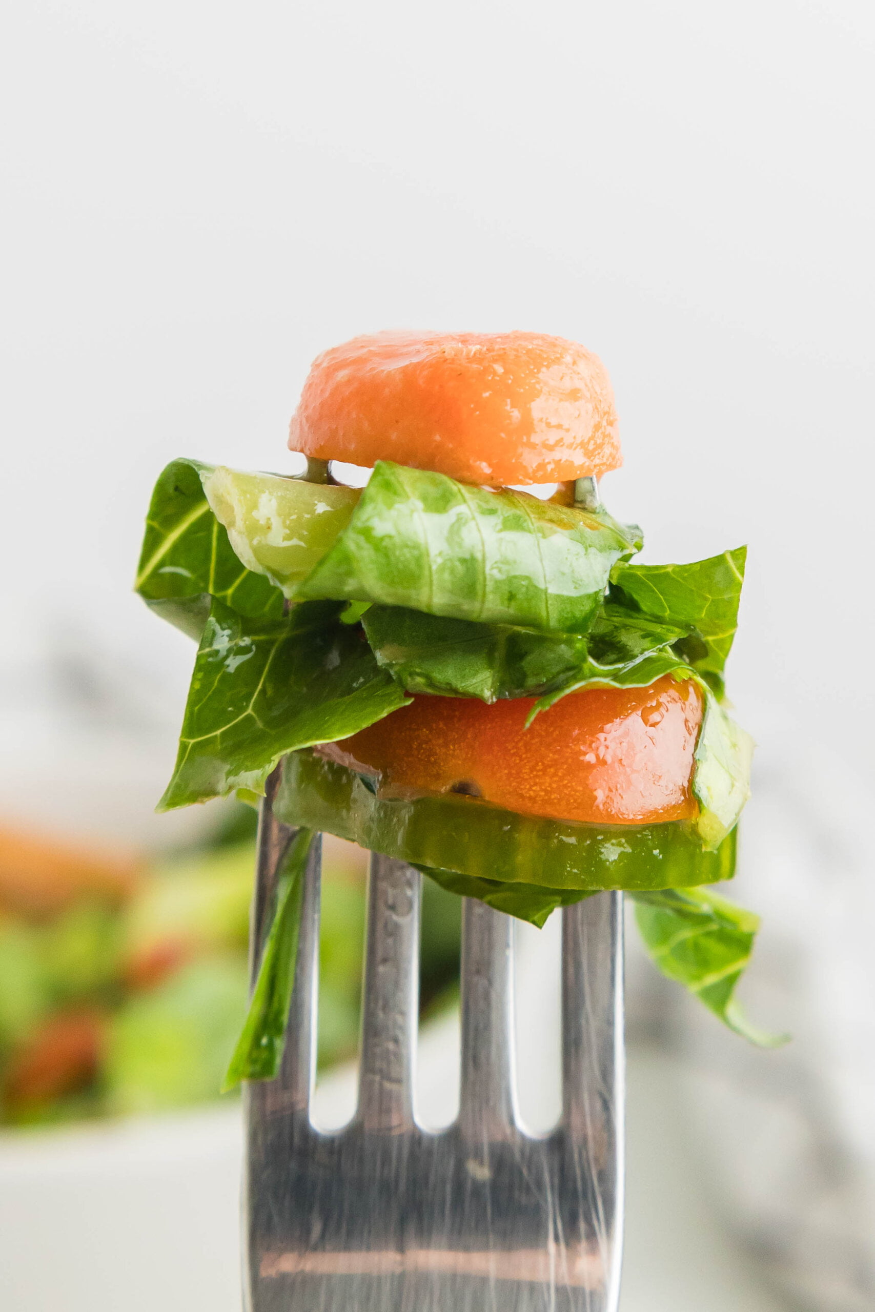 a forkful of garden salad on an inverted fork