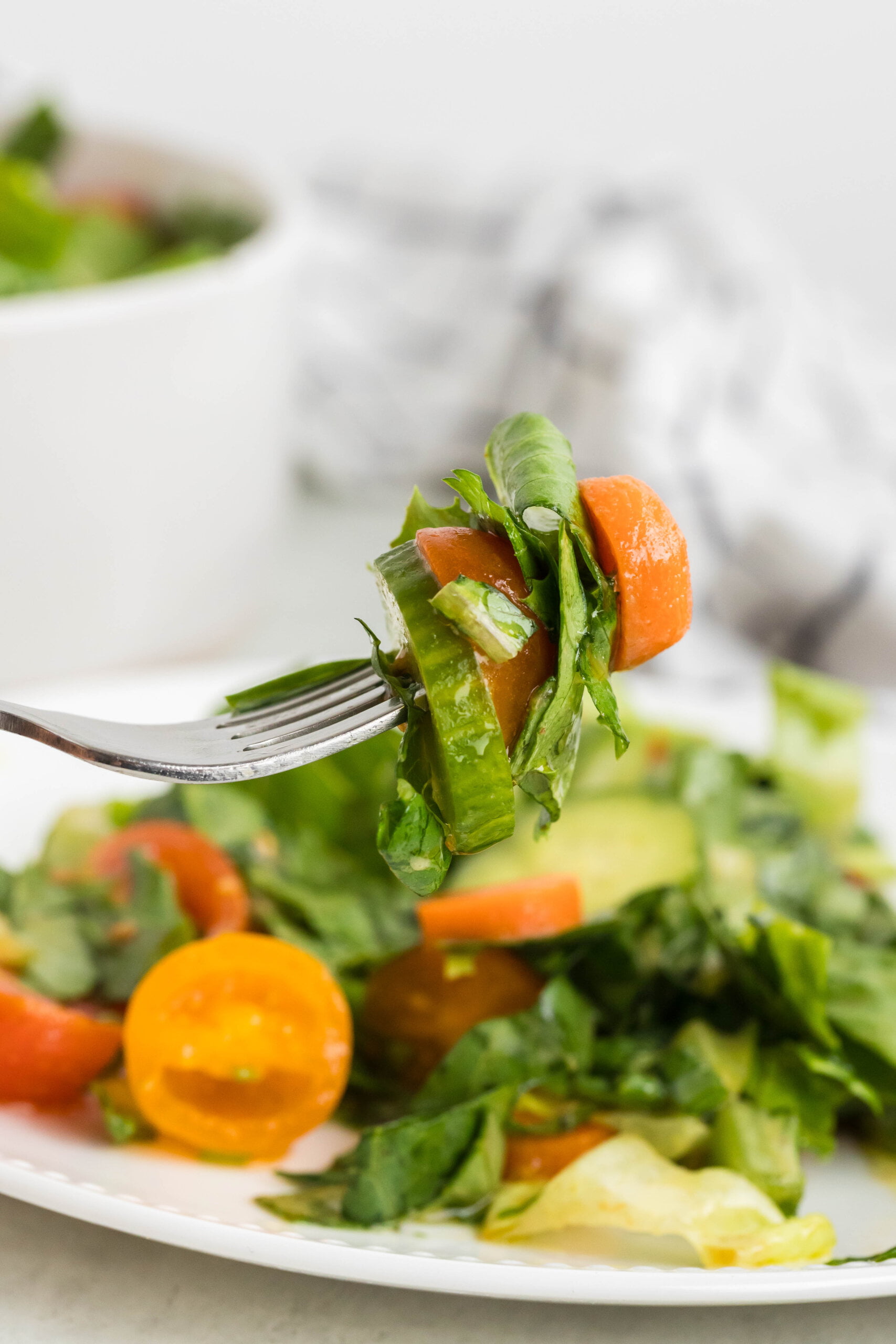 a forkful of a Garden Salad Recipe with Homemade Vinaigrette